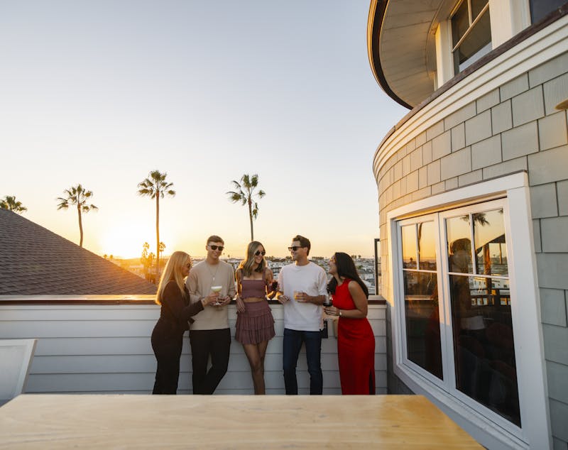 group talking at sunset