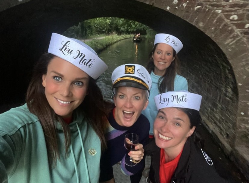  a group of guests aboard a beacon park boats canal boat