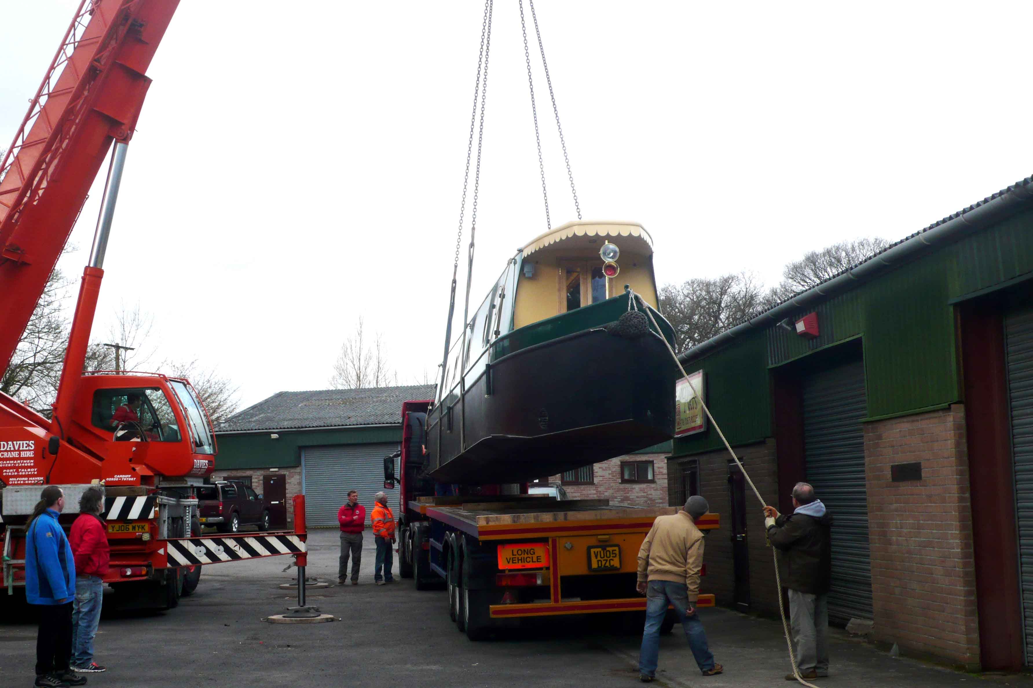 beacon park boats hawk being craned onto a transporter lorry