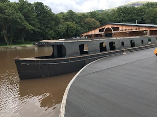 the shell of beacon park boat mallard on the water