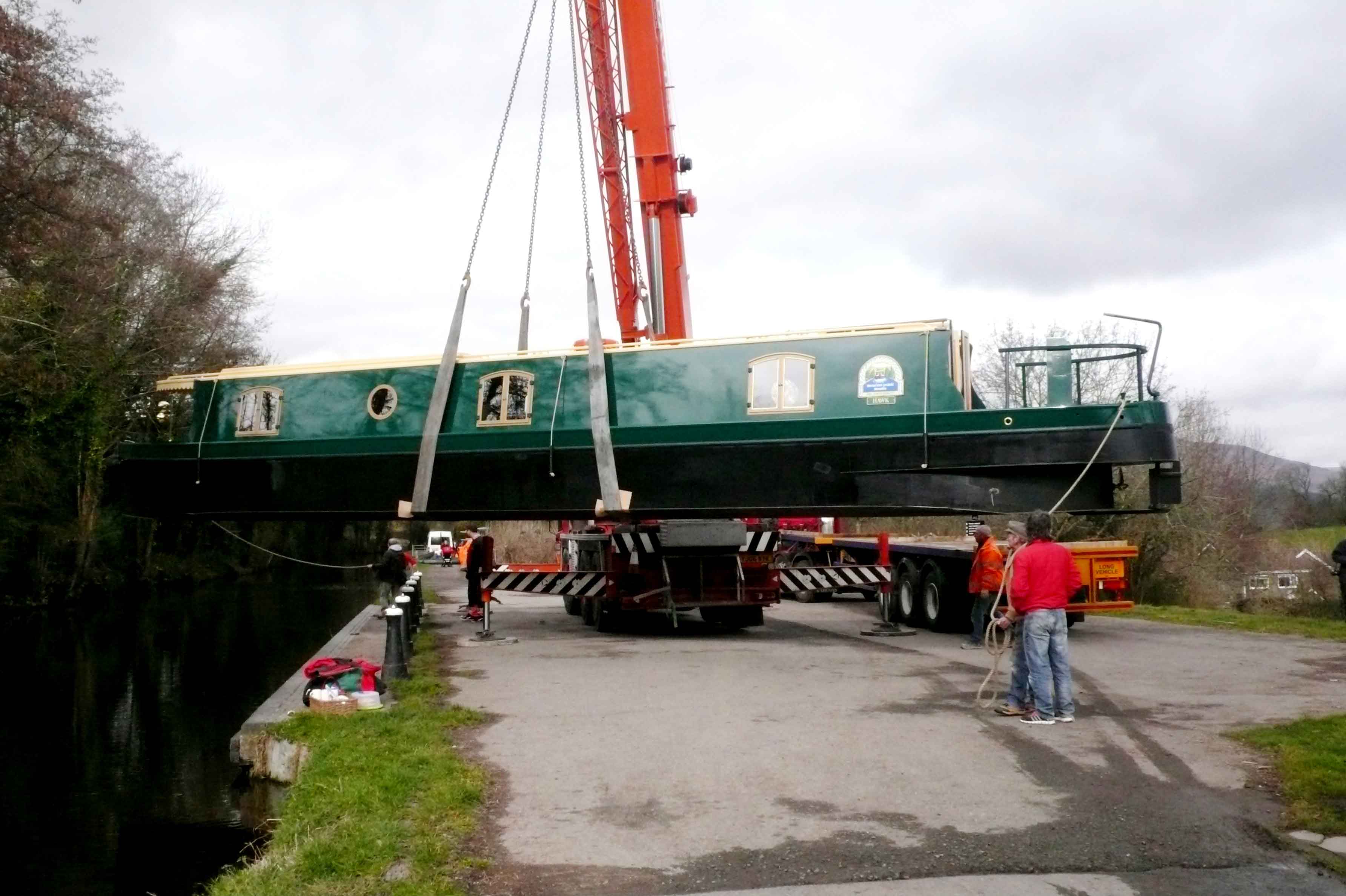 beacon park boats hawk being craned into the mon and brec canal