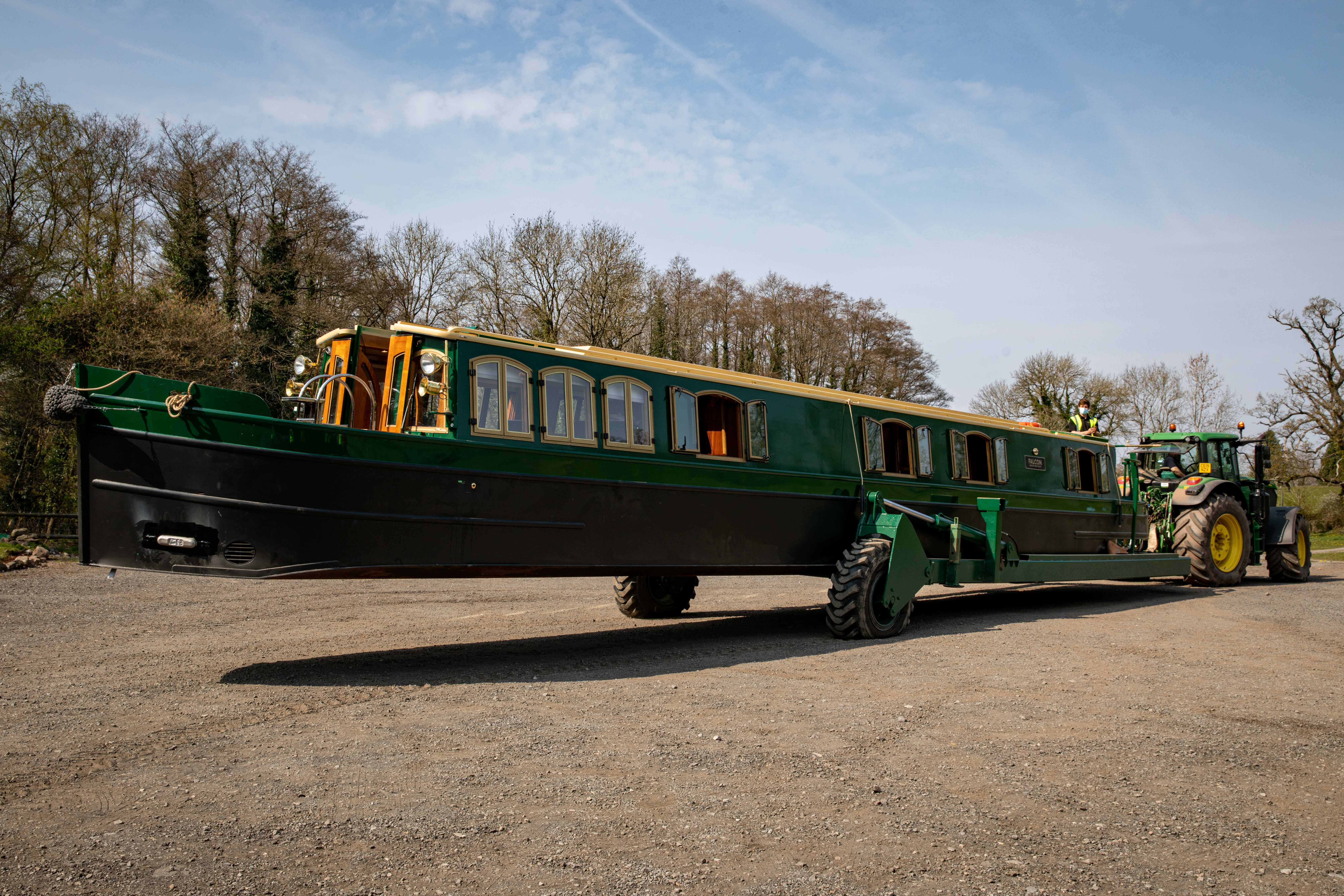 beacon park boat falcon being towed from the boathouse