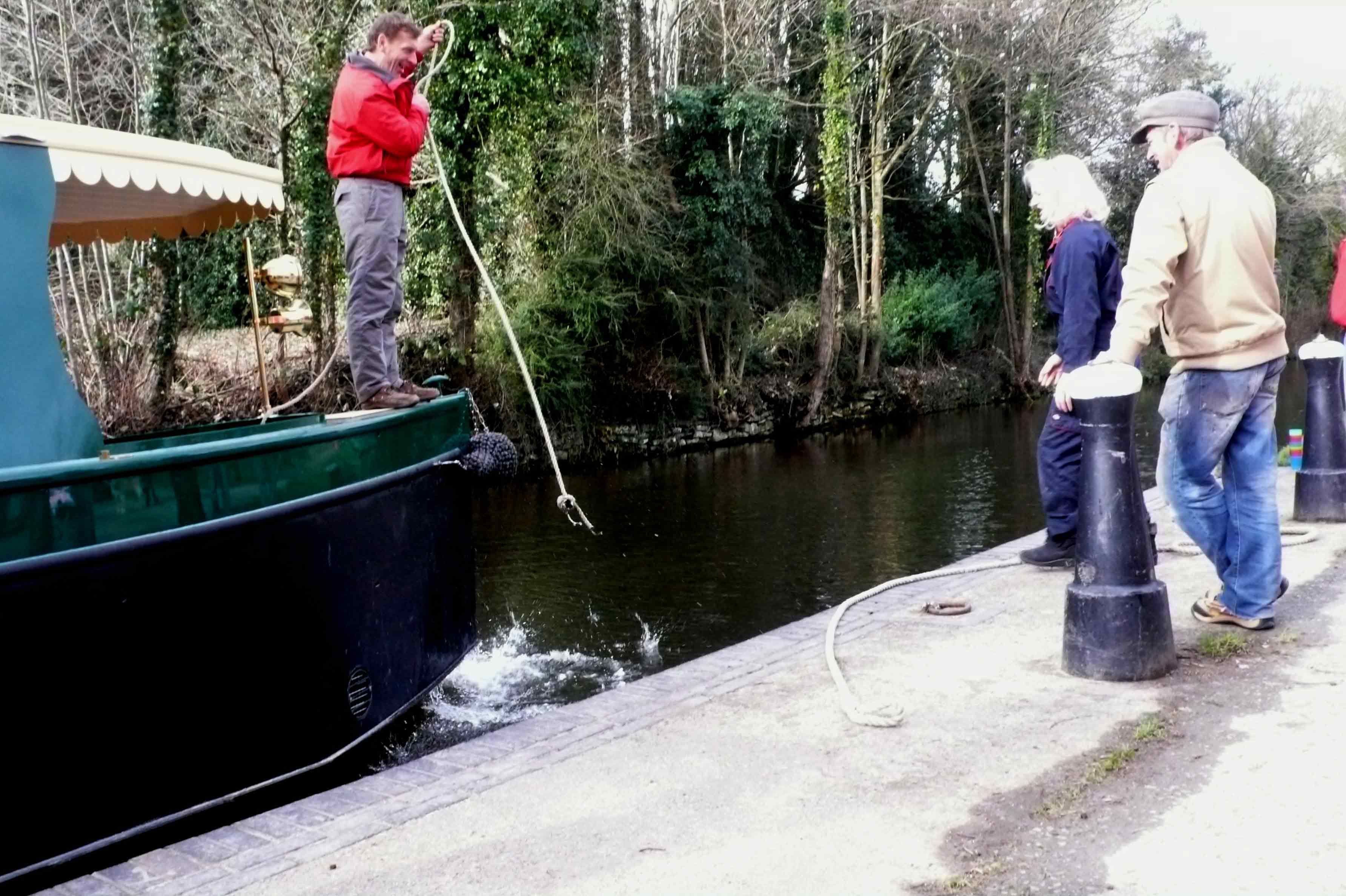 beacon park boats owner alasdair kirkpatrick aboard beacon park boat hawk after it has been lowered into the mon and brec canal