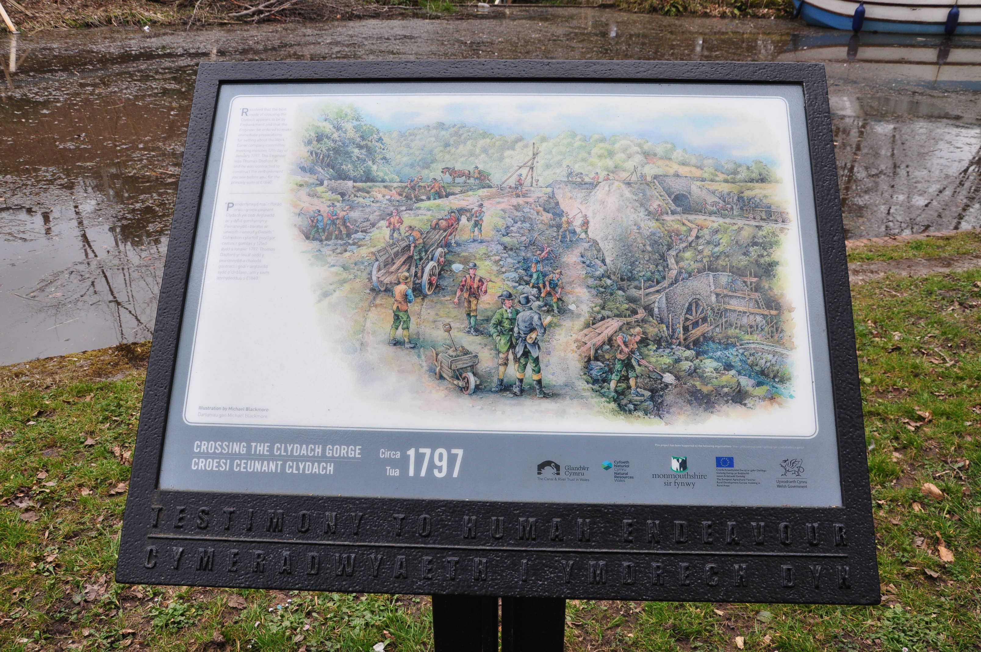 illustrated history of the mon and brec canal on a panel on the canalside