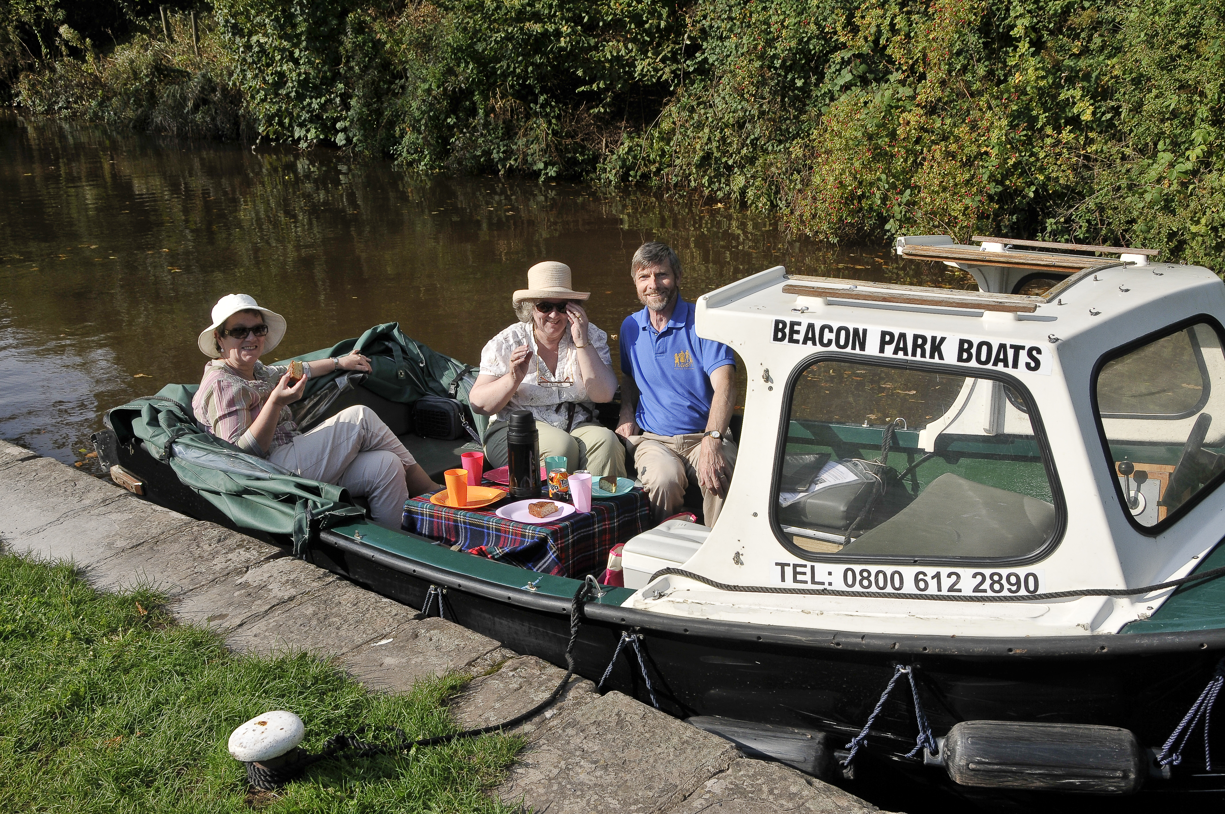 guests enjoying a picnic aboard a beacon park day boat