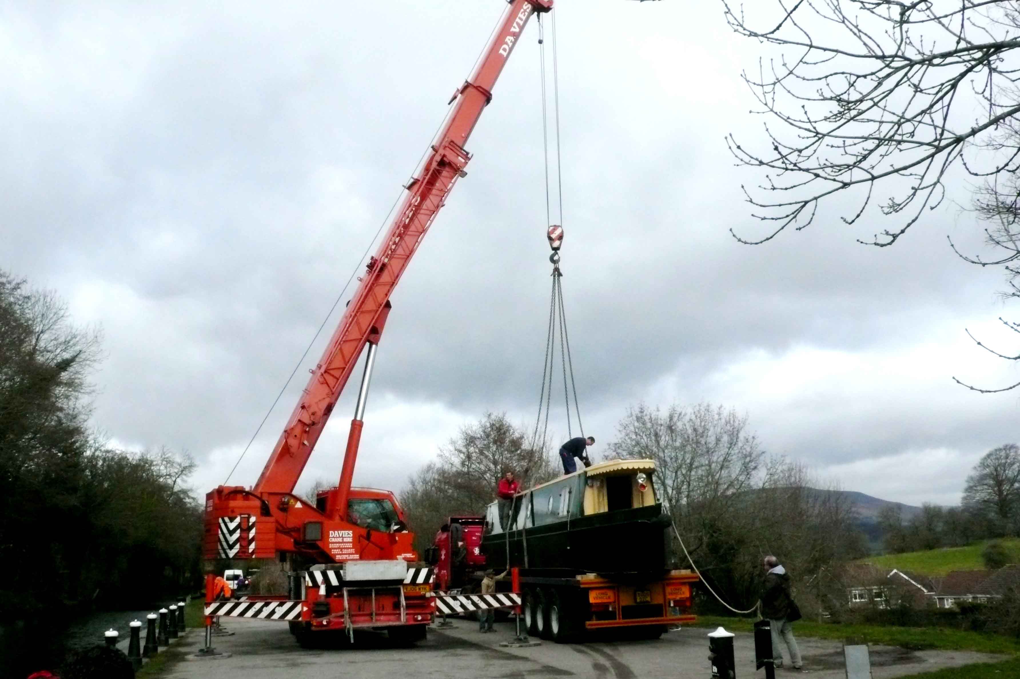 beacon park boats hawk being craned into the mon and brec canal