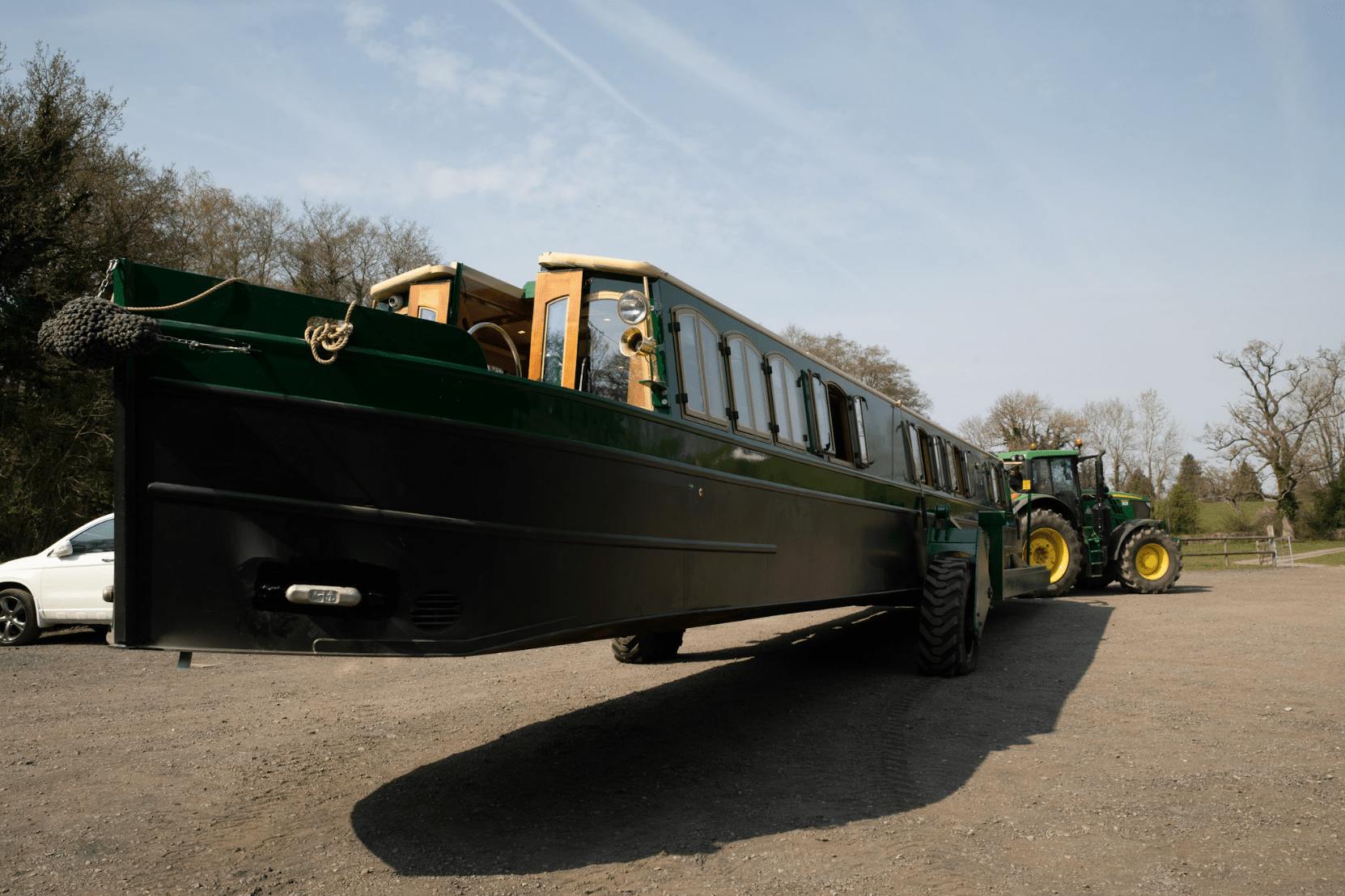 a new beacon park canal boat being transported to the canal