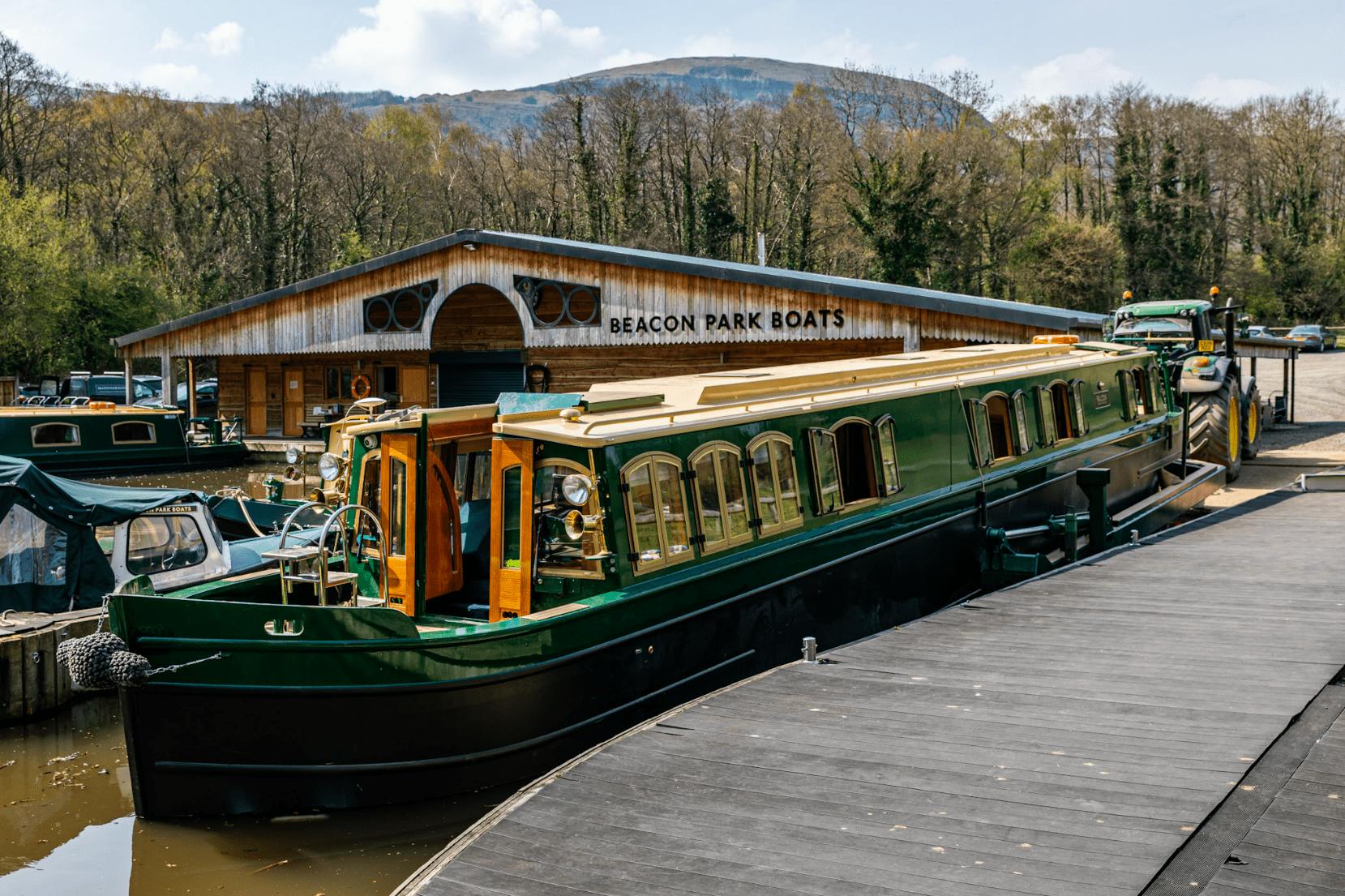 a new beacon park canal boat at the boathouse in llangattock