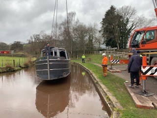 lifting the steel shell of beacon park boat falcon into the mon and brec canal