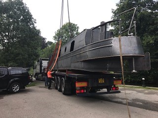 beacon park boat mallard being craned by lorry