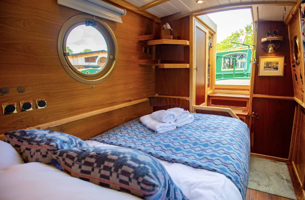 comfortable double bed aboard beacon park boat coot