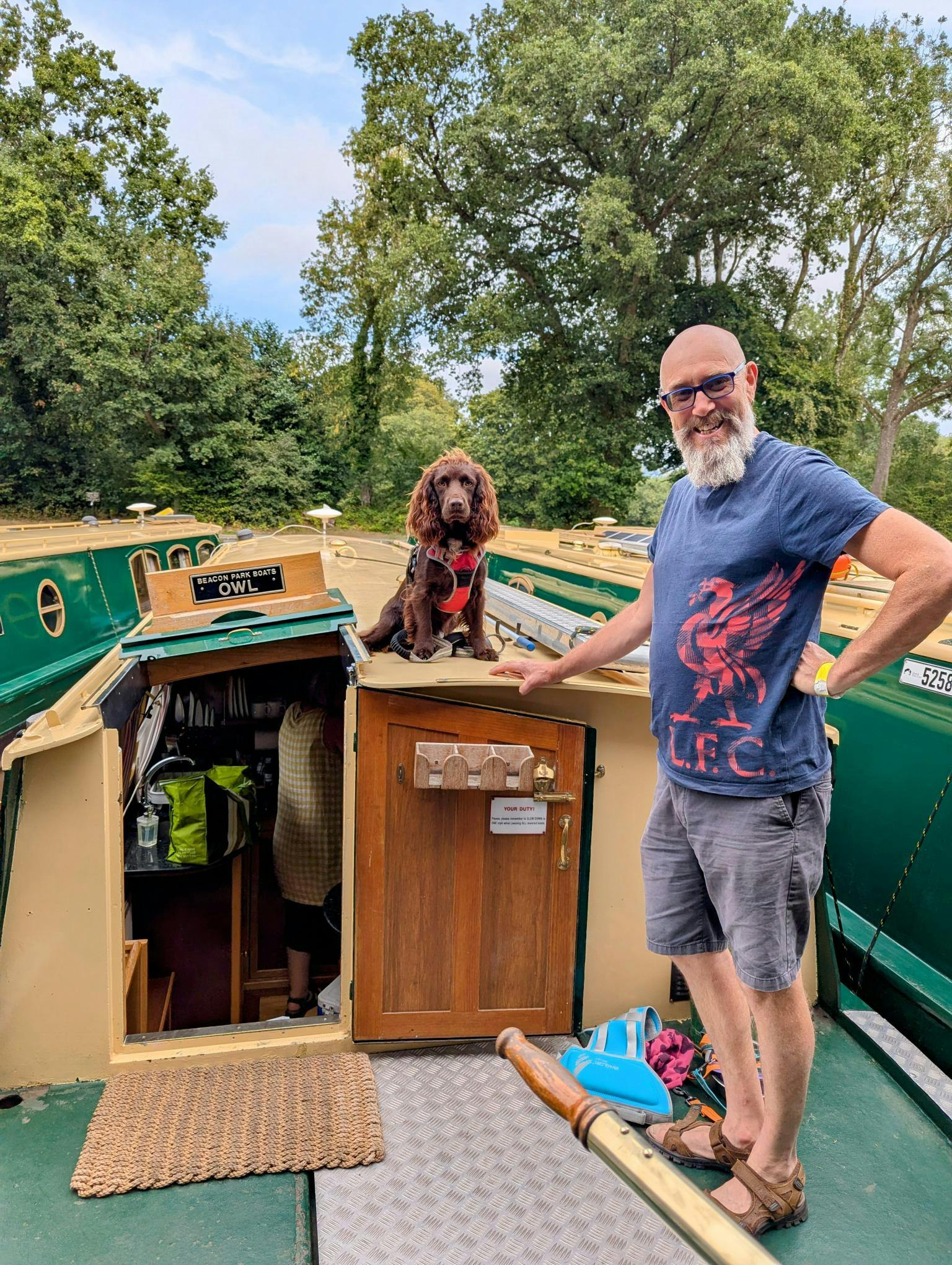a beacon park boat guest and their dog on holiday