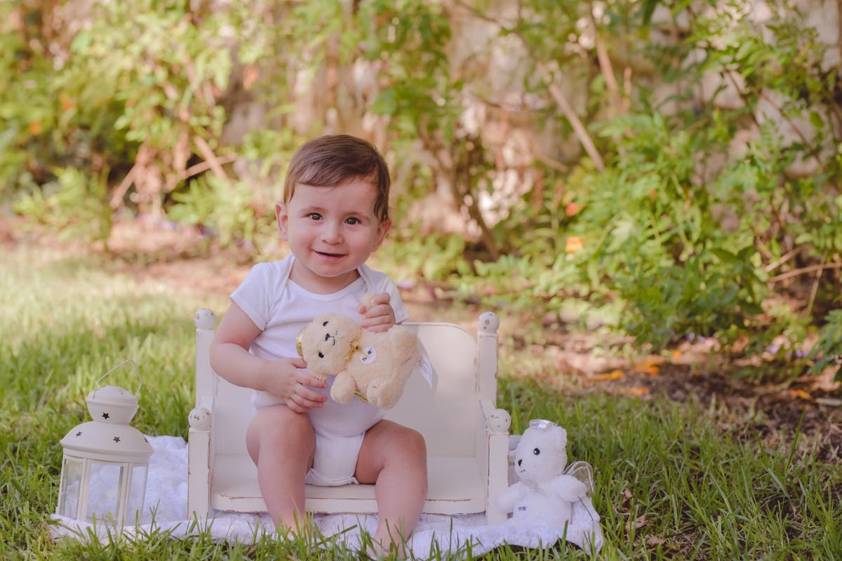 Baby girl sitting on a chair