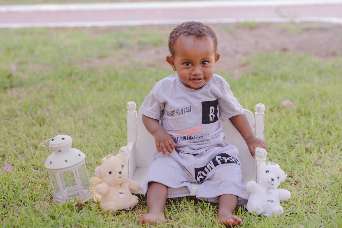 Baby boy sitting on a chair