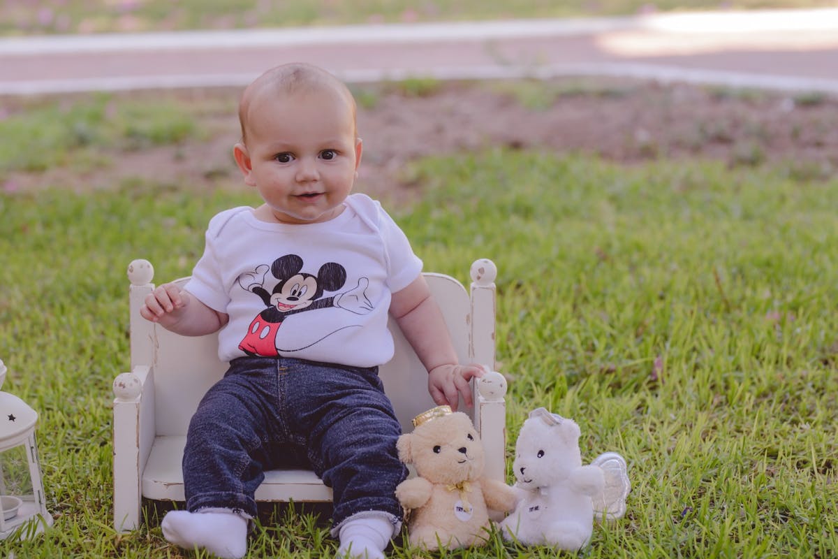 Baby boy sitting on a chair