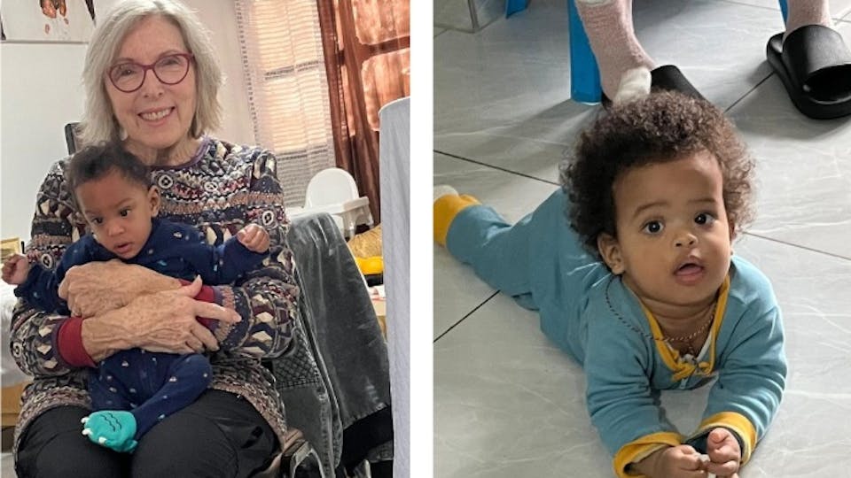 our counselor Laurel holding baby Israel and baby Efrata in blue looking up from the floor