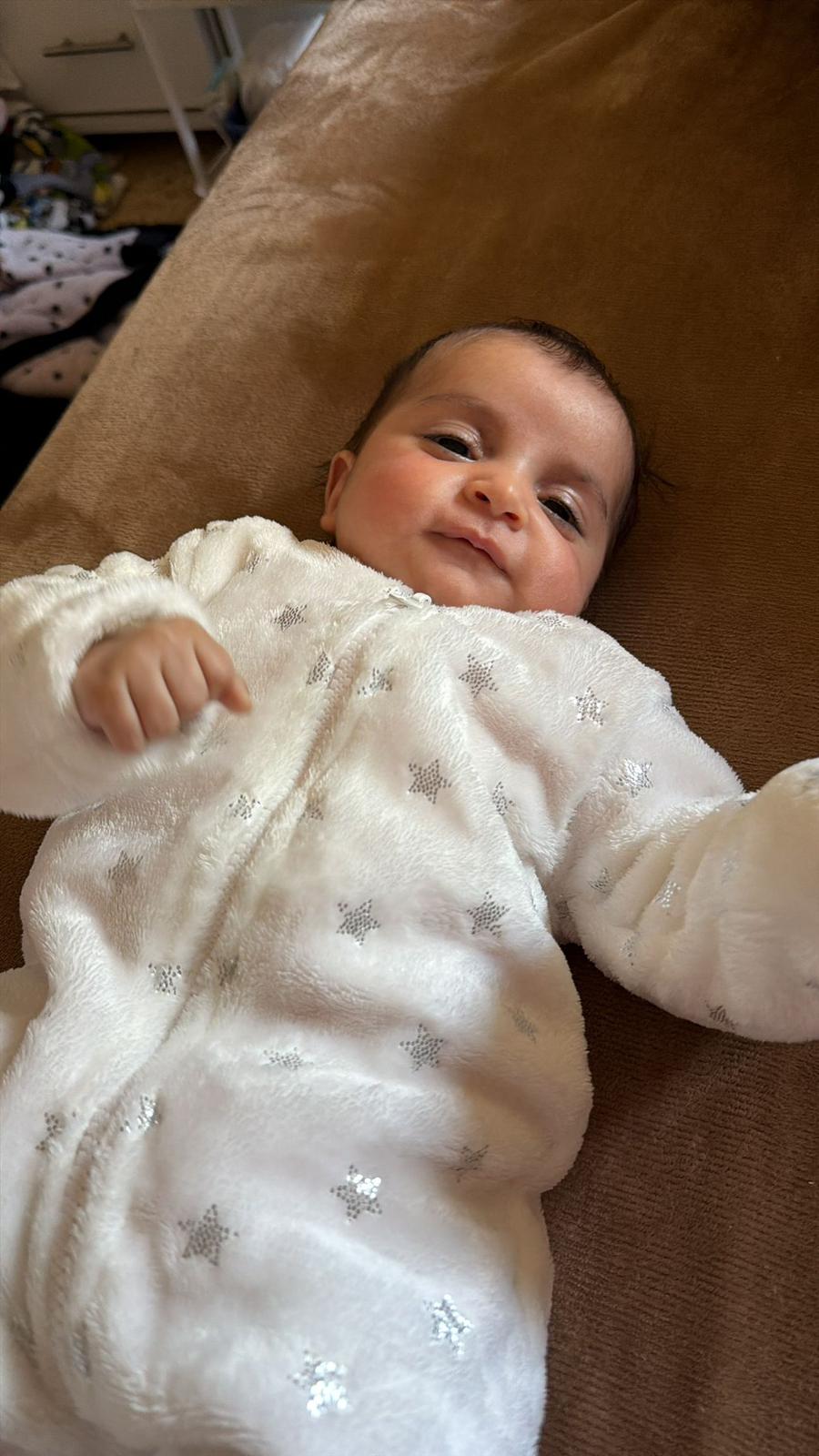 baby elma in white clothes
