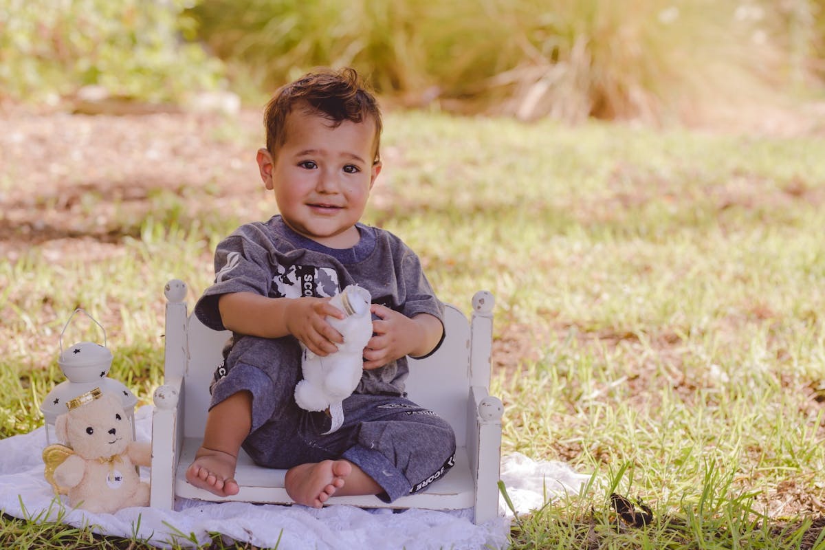 Baby boy sitting on a chair