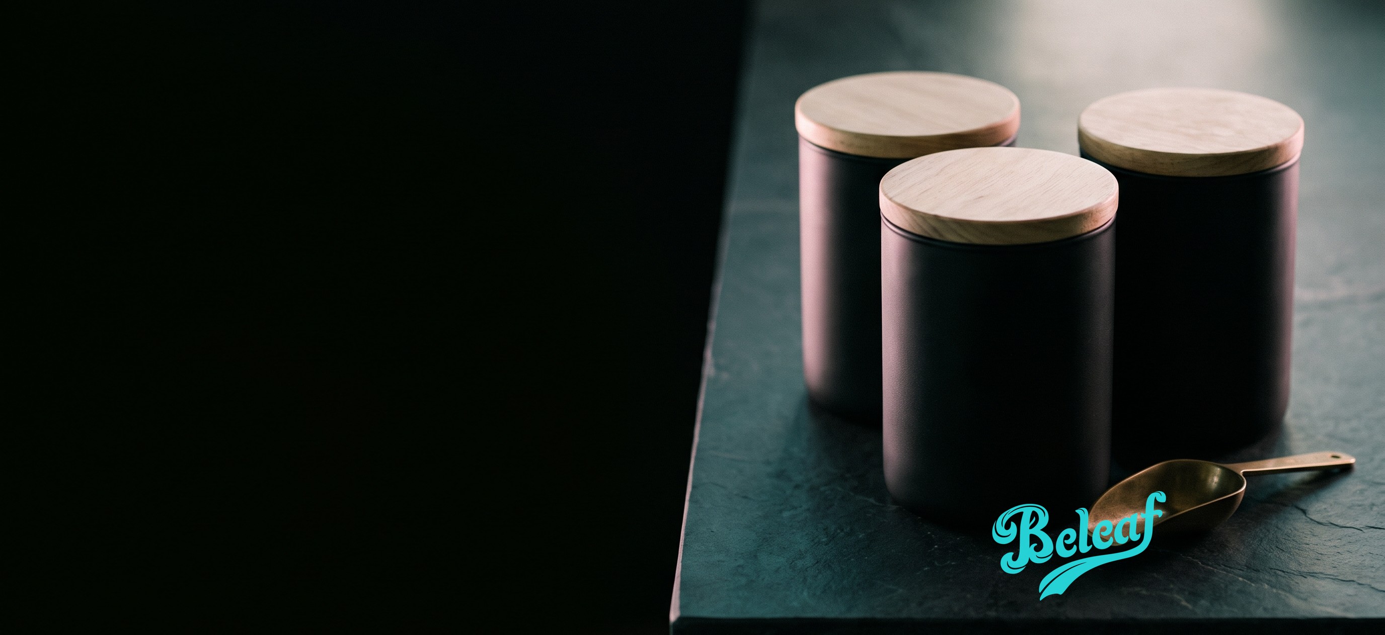 Cannabis storage jars on a dark stone counter with the Beleaf wordmark