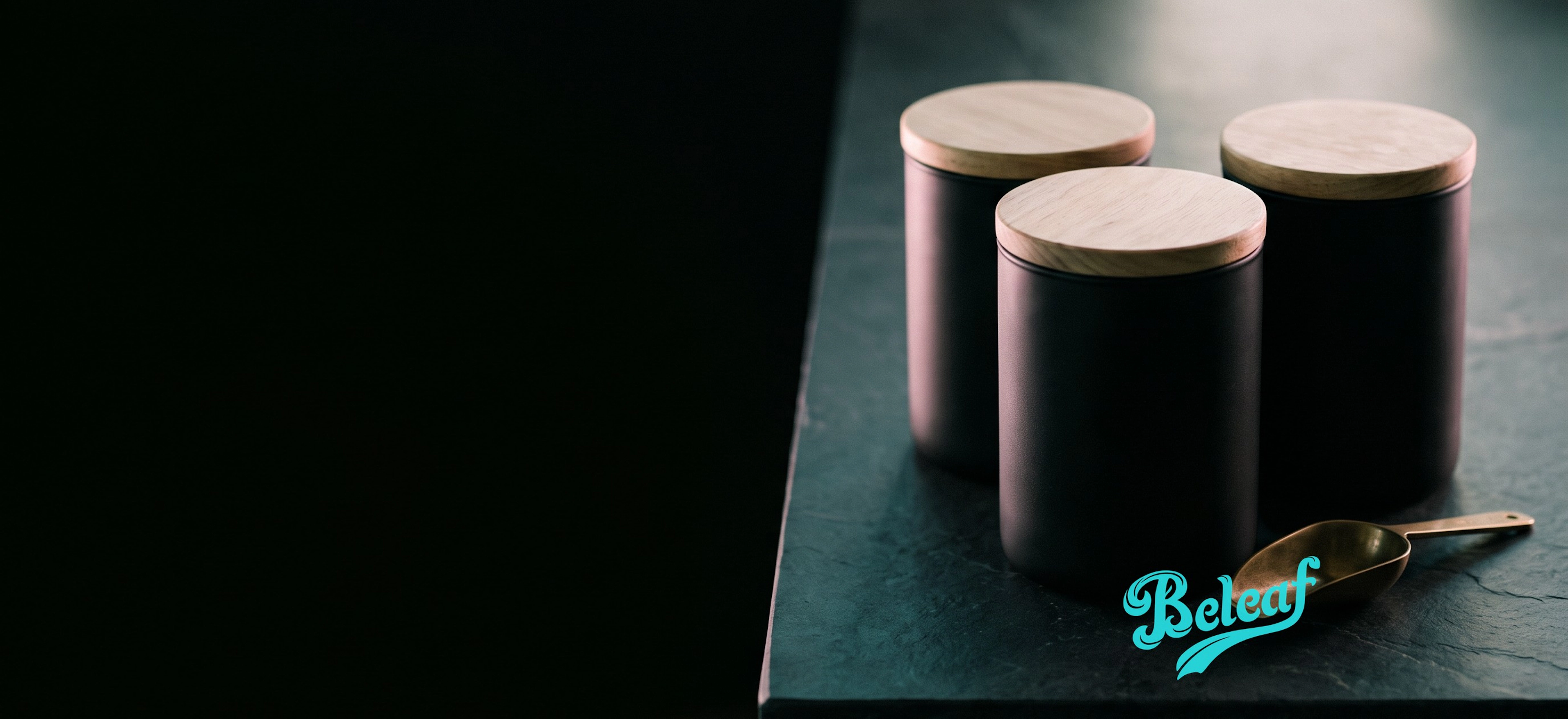 Cannabis storage jars on a dark stone counter with the Beleaf wordmark