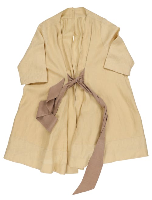 Linen frock coat with wild silk ribbon belt. a made-to-measure adaptiable garment, that can be unfasten to two seprate pieces, for ease of dressing and undressing on a wheelchair.