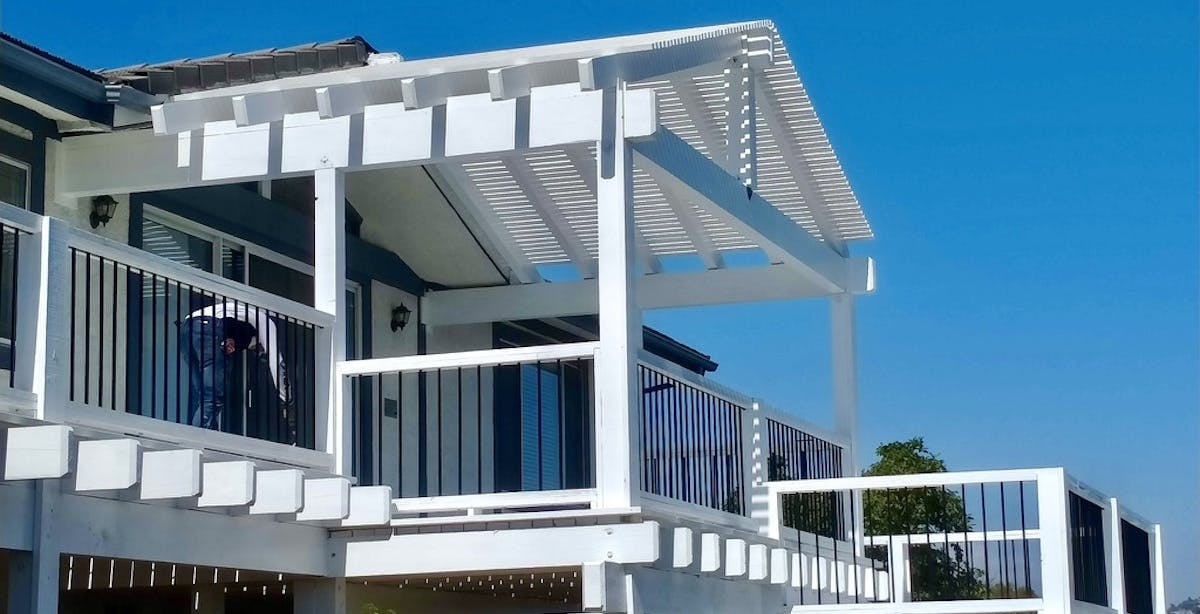 A photo of an exterior home renovation with a new deck built by Belong Pros in San Dimas