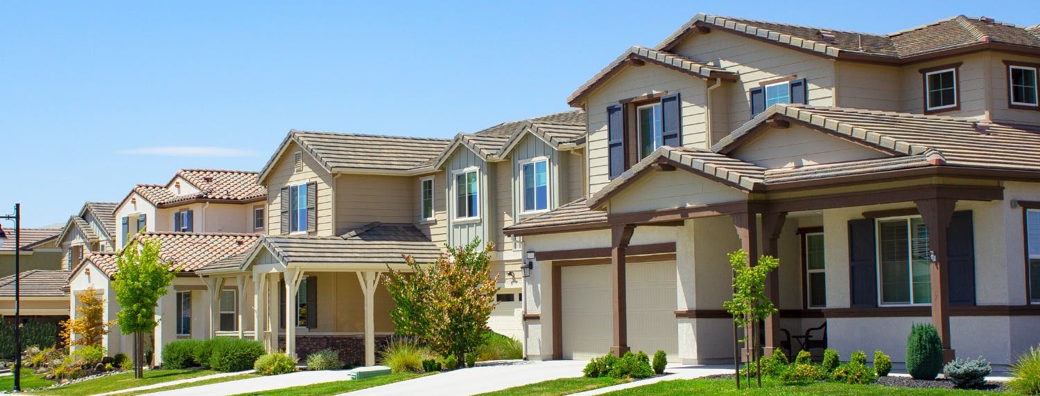 Row of suburban neighborhood homes, depicting homeownership and management of rental property