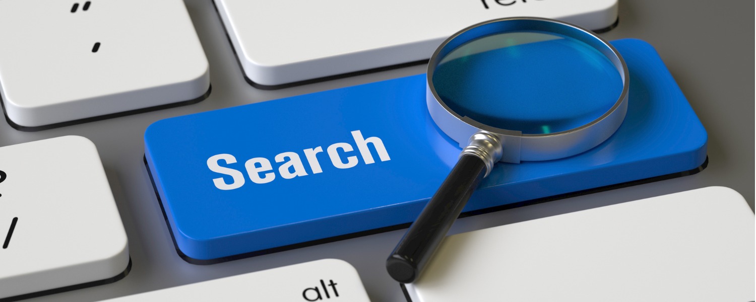 Image of a magnifying glass on a keyboard, with a blue key titled "search", depicting online research of property managers