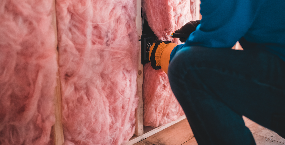 An image of insulation being installed in walls, a cost-effective way to make your rental home more sustainable