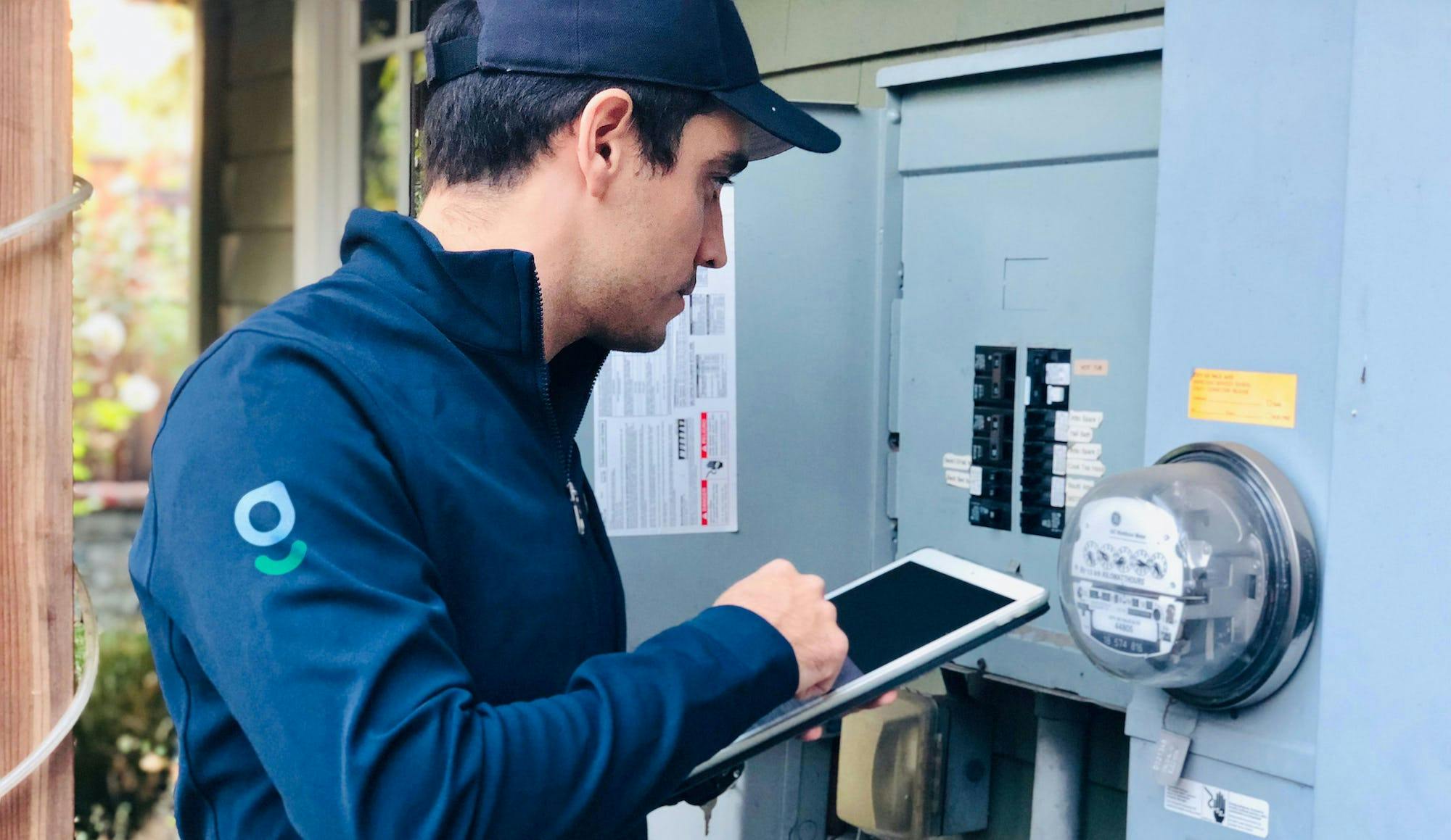 A Belong team member inspects a home to prepare it for the rental market, as a unique alternative to property management services