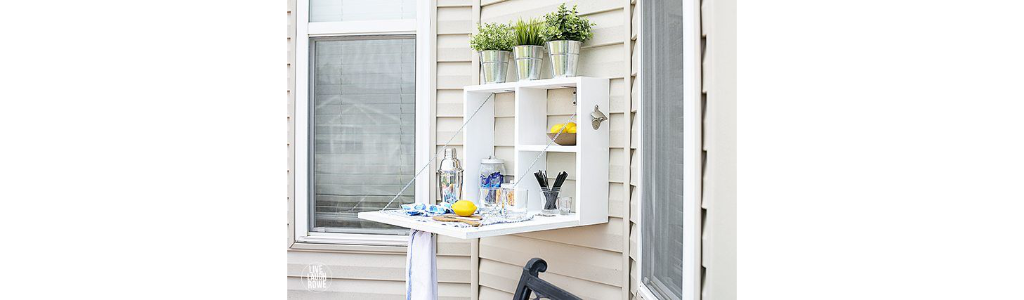 An outdoor drink serving station with cocktail shaker and lemons