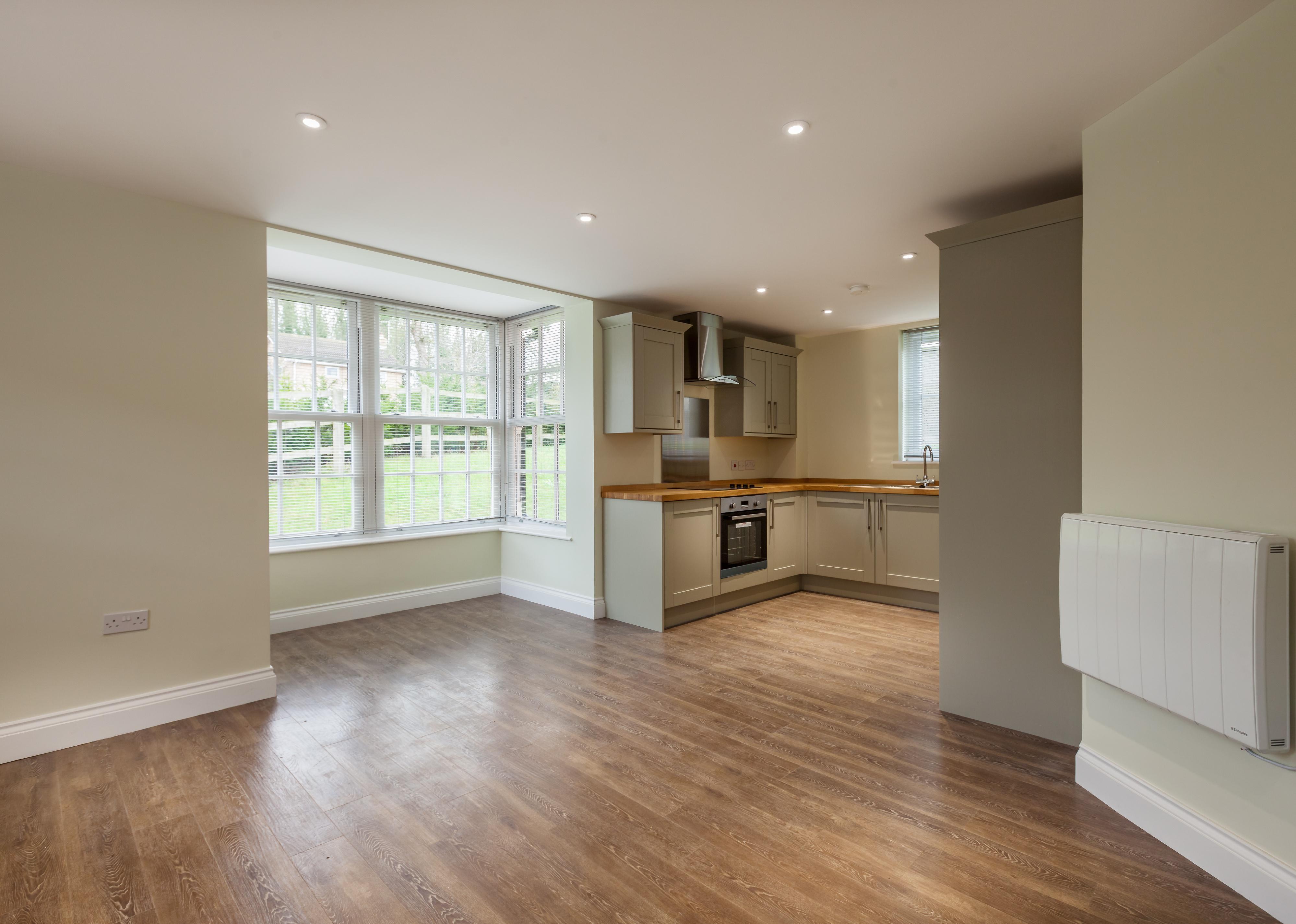 A vacant rental property, showing the kitchen and living areas