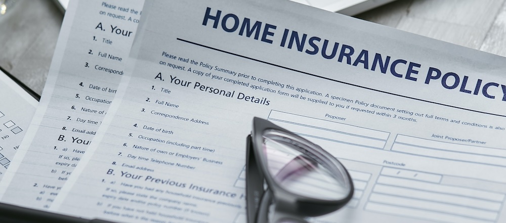 A photo of a home insurance policy, which should be tailored to your rental home as a landlord