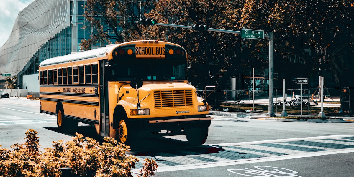 A photo of a school bus in the streets of Miami, Florida. Find out the best school districts in Miami to own rental property. 