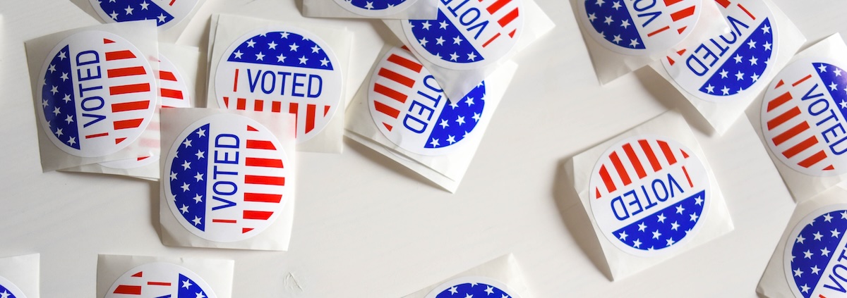 A table covered with "I VOTED" stickers with the American Flag for the 2024 election year 