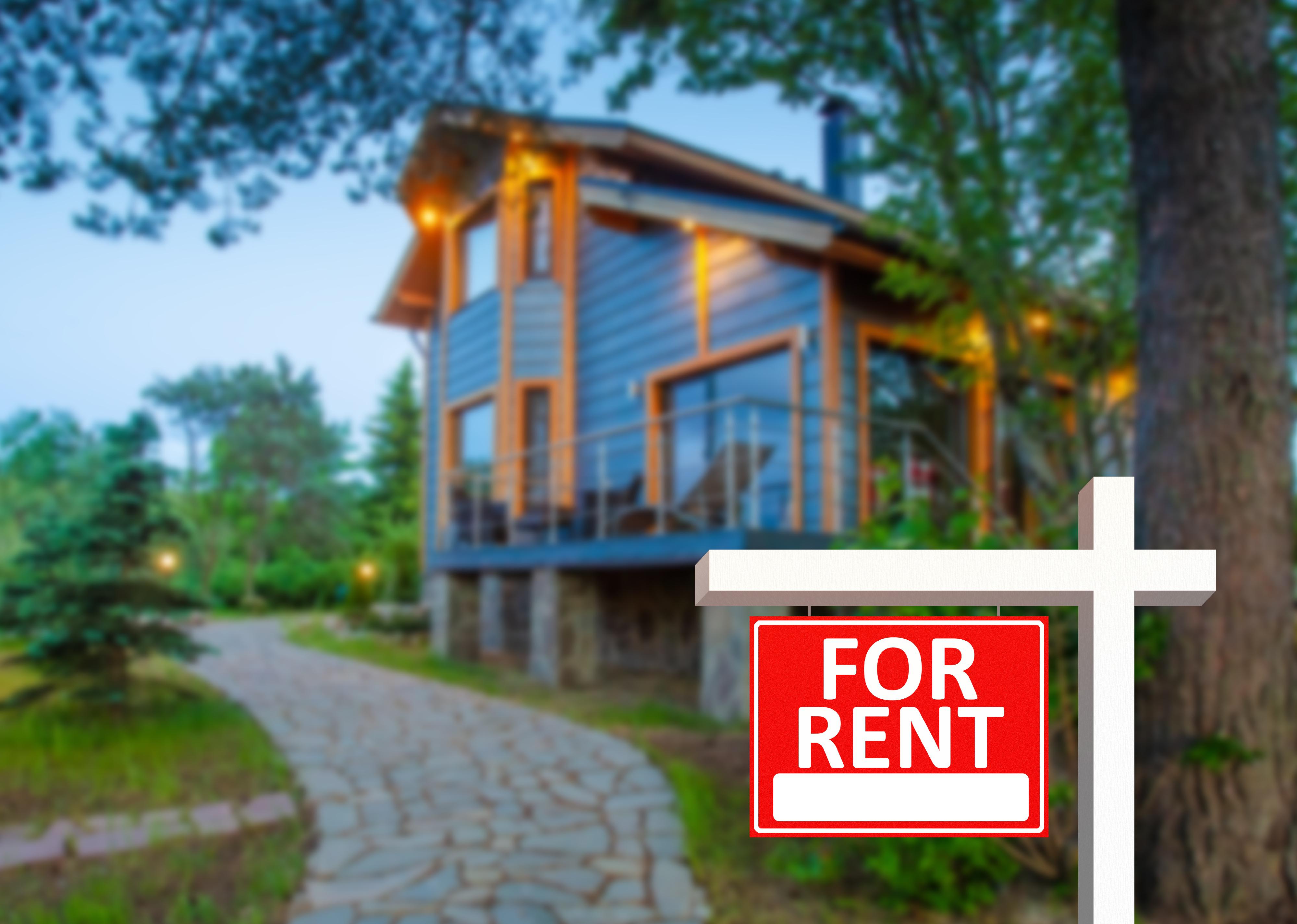 A photo of a modern family home surrounded by trees and a garden path, with a "for rent" sign image in the front