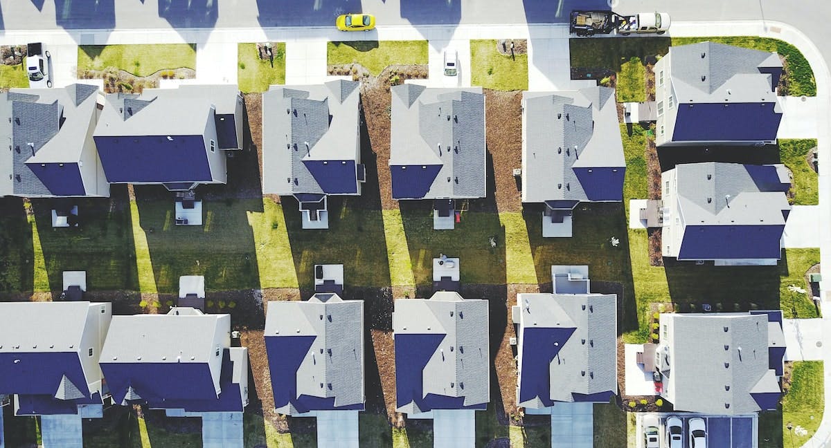 An aerial overhead photo showing similar houses in a neighborhood, determining rental pricing factors for your home