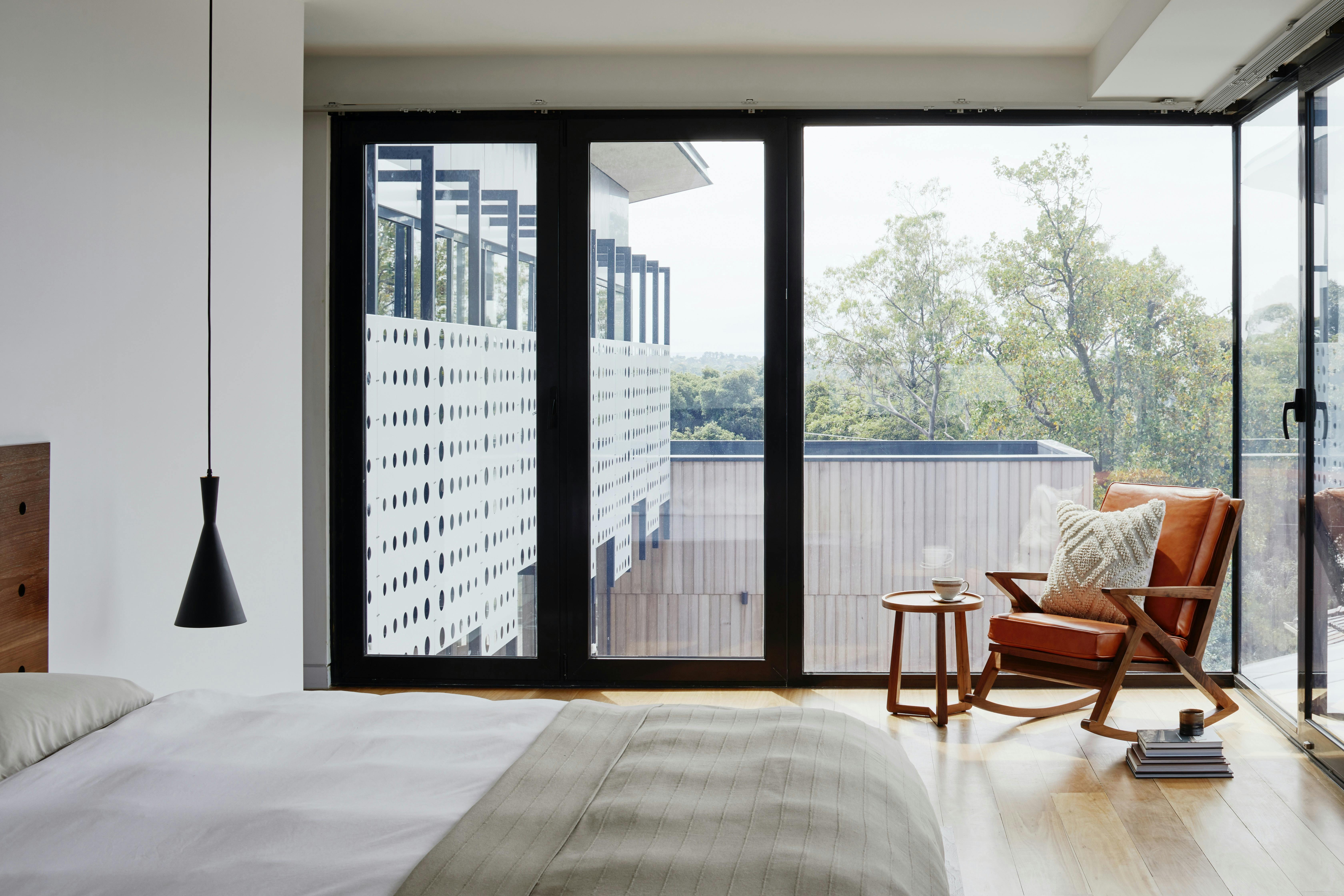 rental property bedroom with large windows