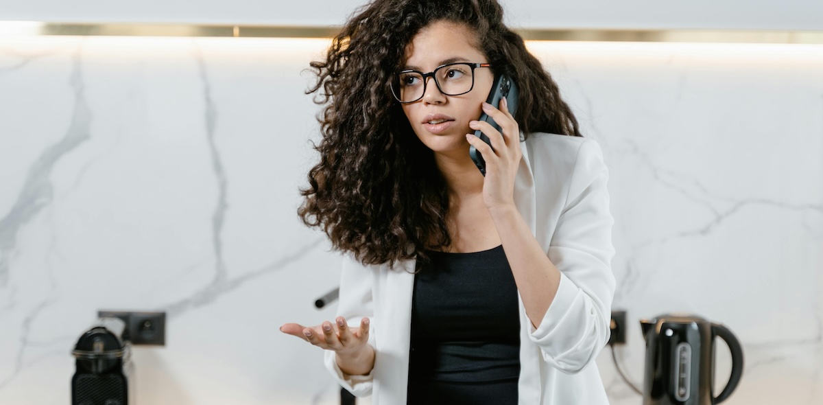 A young renter complains to her landlord about a rental home issue