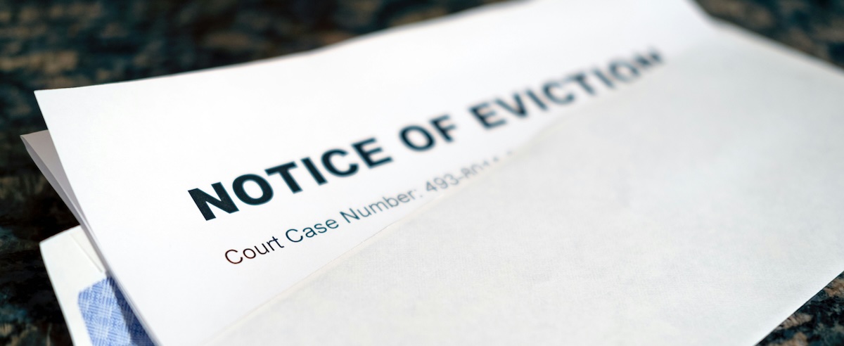 An open envelope showing a notice of eviction letter