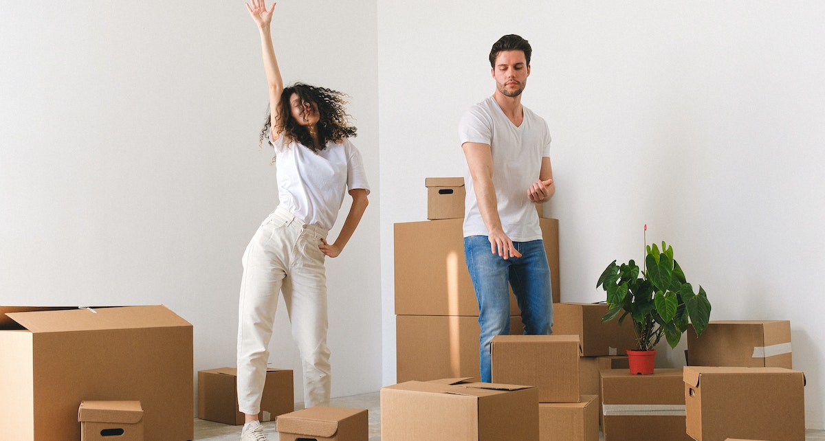 Happy residents moving into a home on the Belong residential network