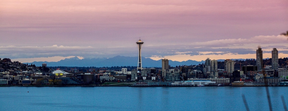 A photo of Seattle, a high demand rental market, with the space needle and Puget Sound visible