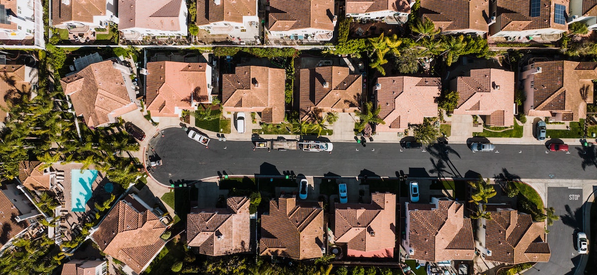 An aerial view of a suburban street in California, homes that are covered by Assembly Bill 1482 for rent control. 
