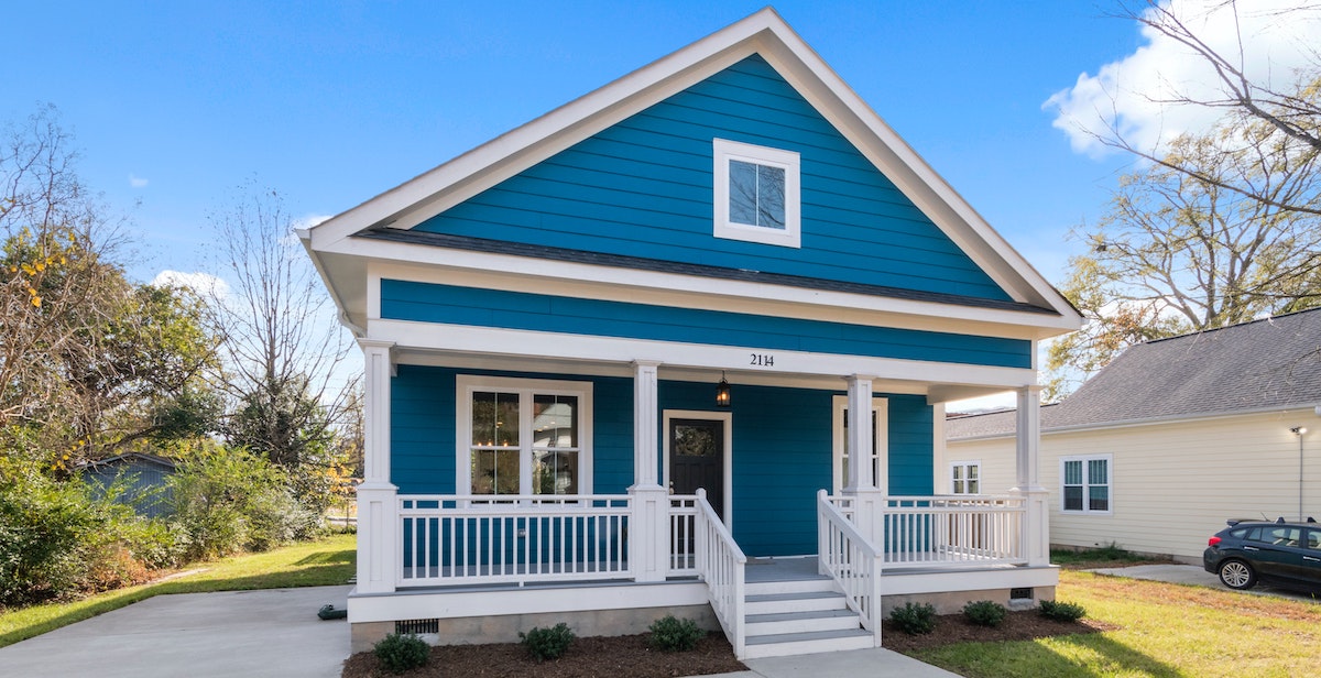 A photo of a traditional single-family home. If you're considering purchasing a property for the rental market, our asset manager weighs in on the question "is now a good time to be acquiring a rental property?"