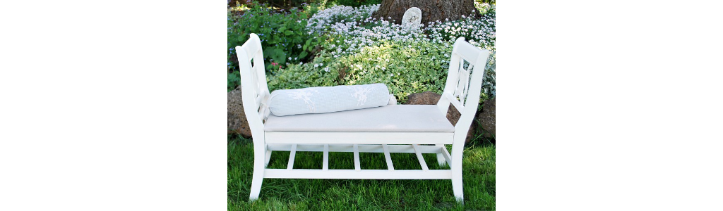 An outdoor bench in a backyard