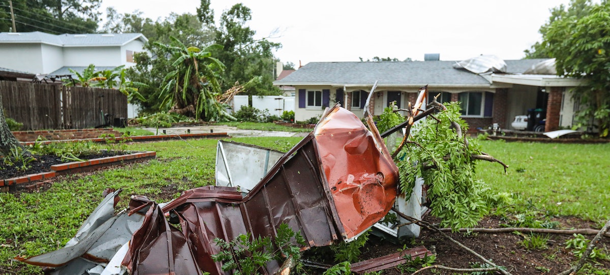 A photo of a Florida home damaged by storms. With hurricanes and natural disasters unavoidable, learn more about how to protect your investment property in a flood zone. 