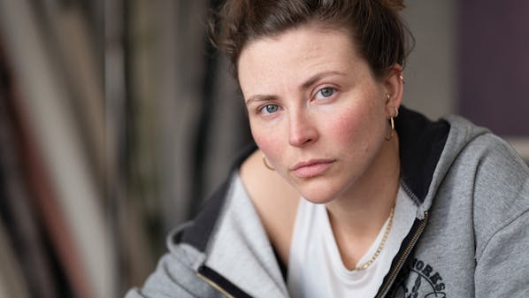 headshot of a London actor and some canvas backdrops