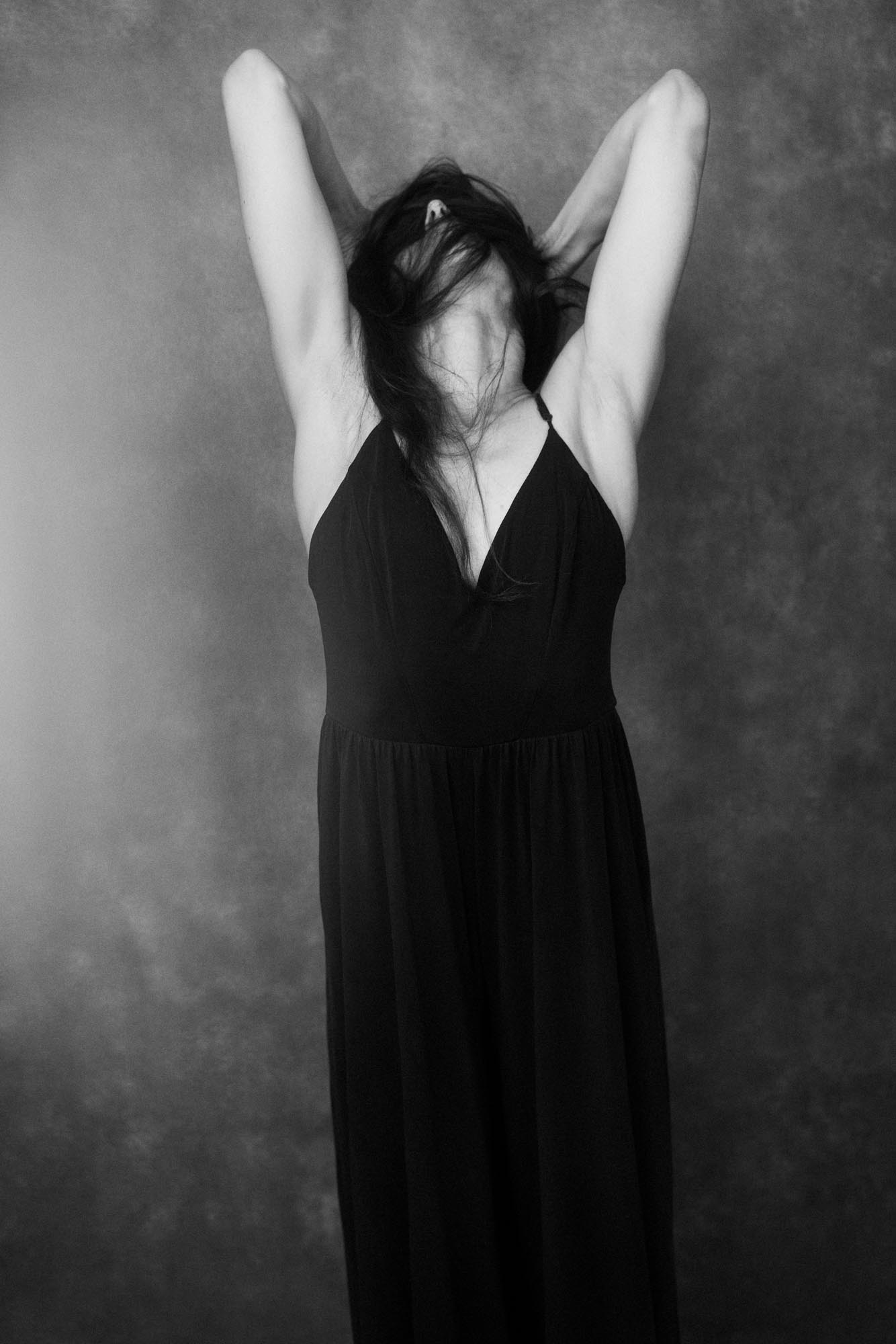 a black and white photo of a modern dancer 