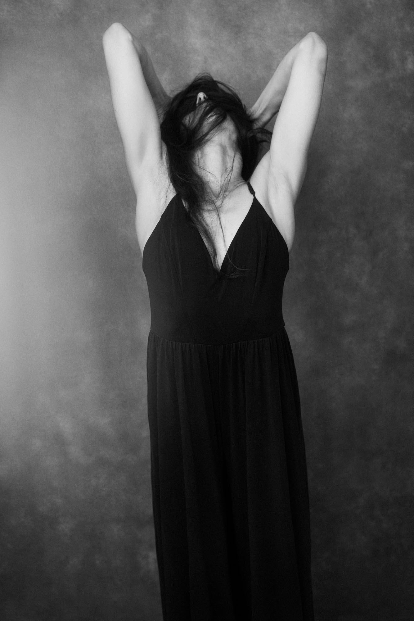 a black and white photo of a modern dancer