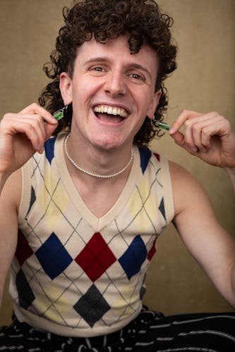 headshot of an actor smiling